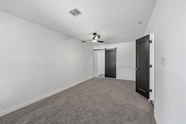 an empty room with a empty space and windows