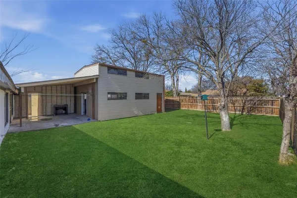 a view of a yard in front of a house
