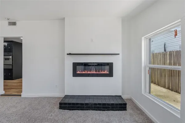 a living room with a fireplace