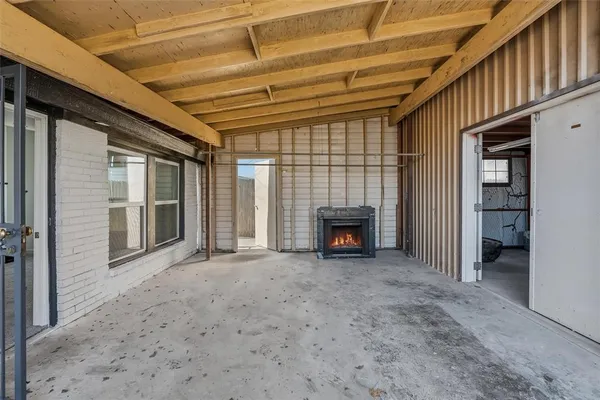 a view of an empty room with a fireplace