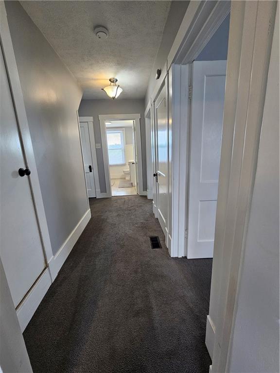 952 Roup Avenue Brackenridge, PA 15014 - Photo 12 of 25 a view of a hallway with wooden floor