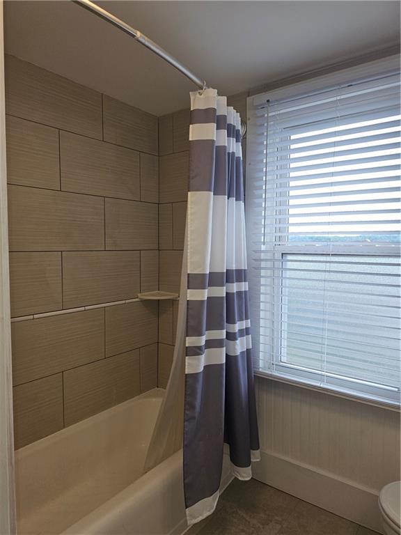 952 Roup Avenue Brackenridge, PA 15014 - Photo 14 of 25 a bathroom with a bathtub and a shower