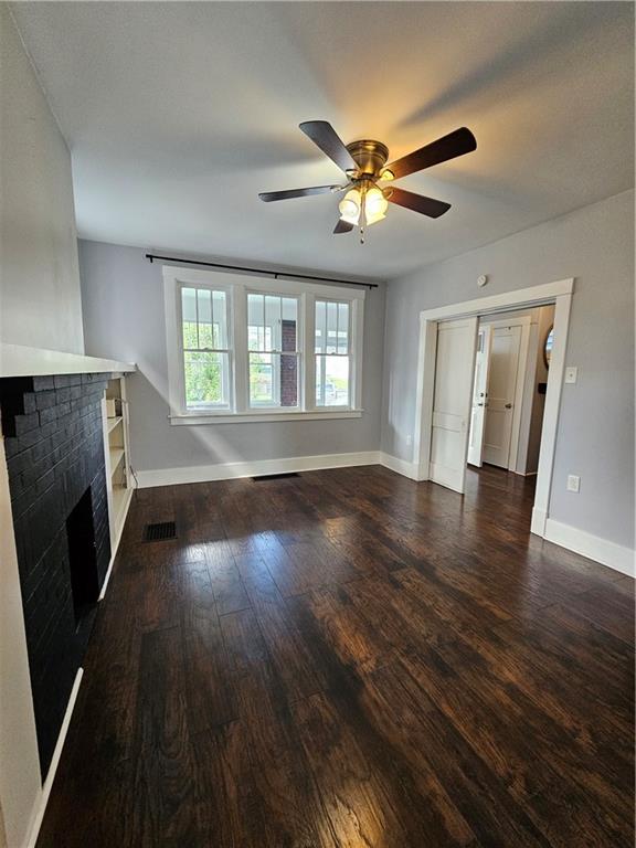 952 Roup Avenue Brackenridge, PA 15014 - Photo 5 of 25 a view of an empty room with wooden floor and a window