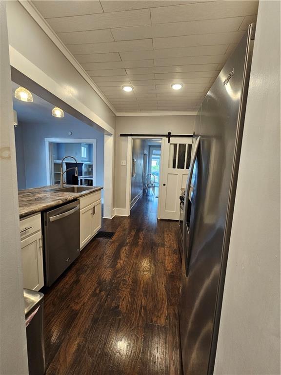 952 Roup Avenue Brackenridge, PA 15014 - Photo 9 of 25 a view of kitchen with sink microwave and refrigerator