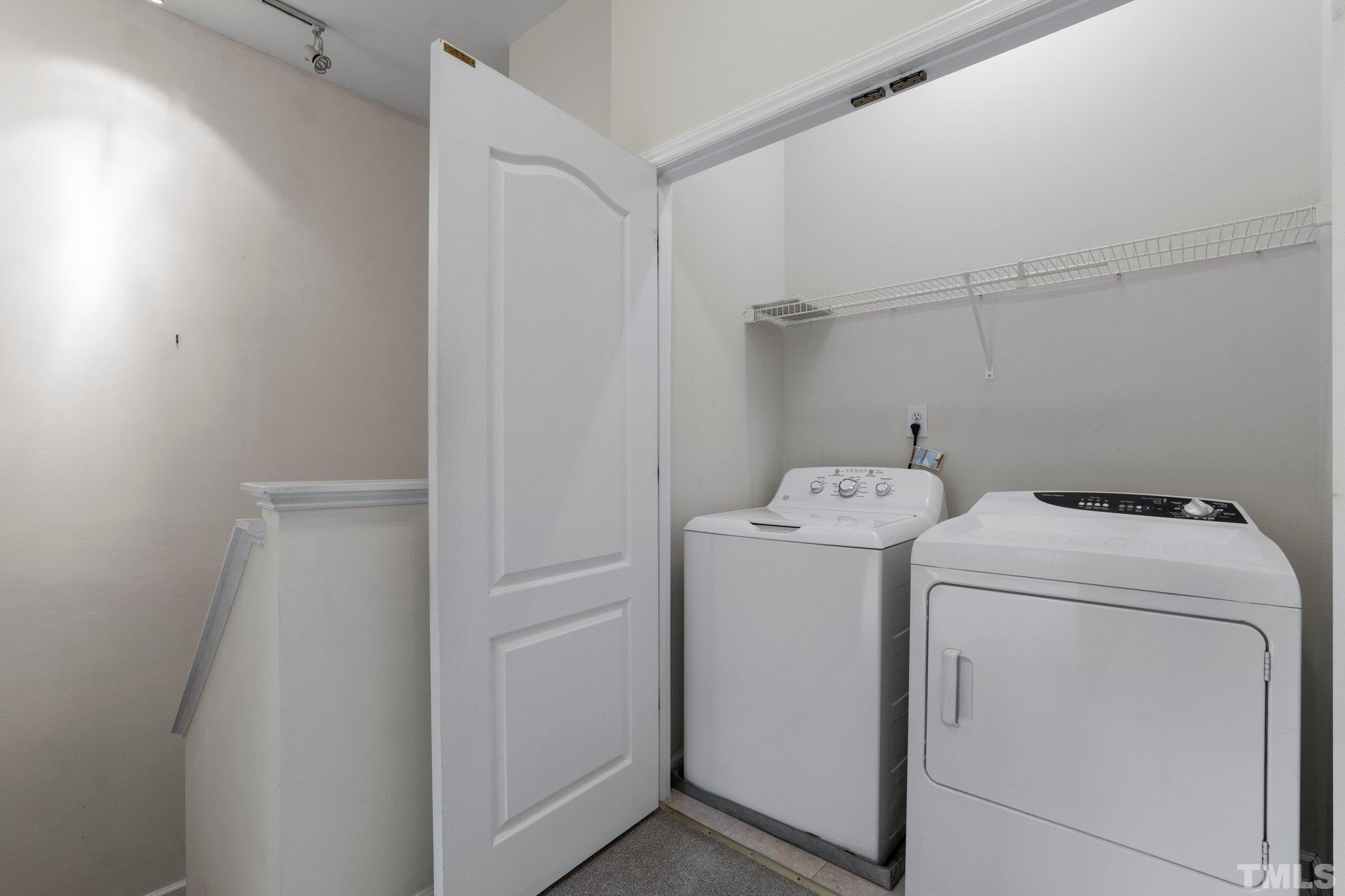 6831 Middleboro Drive Raleigh, NC 27612 - Photo 21 of 32 a utility room with dryer and washer