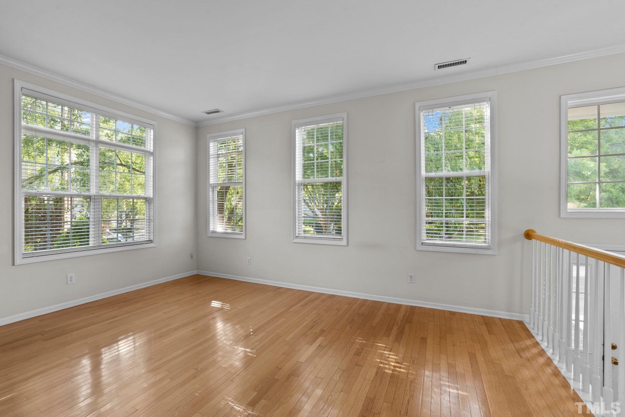 6831 Middleboro Drive Raleigh, NC 27612 - Photo 4 of 32 a view of an empty room with a window