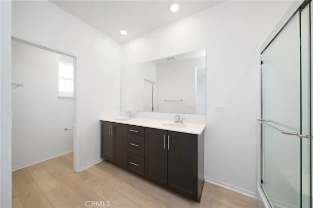 a room with a sink and a mirror