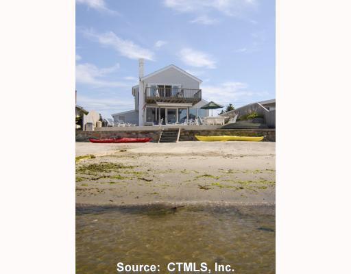 15 Pointina Road Westbrook, CT 06498 - Photo 1 of 1 a view of a lake with a building in the background