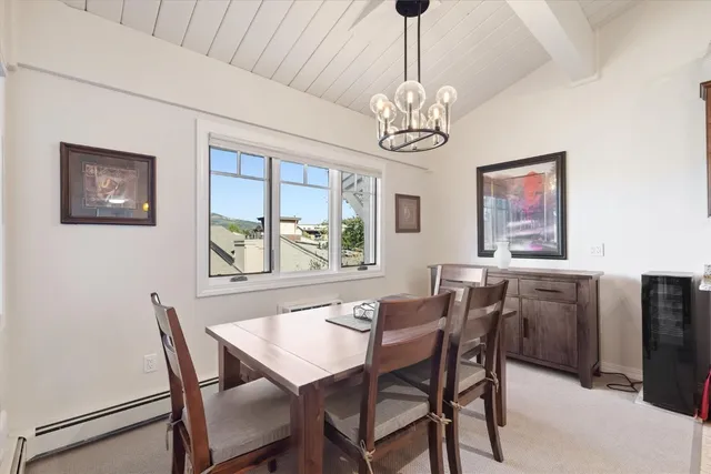a view of a dining room with furniture window and chandelier
