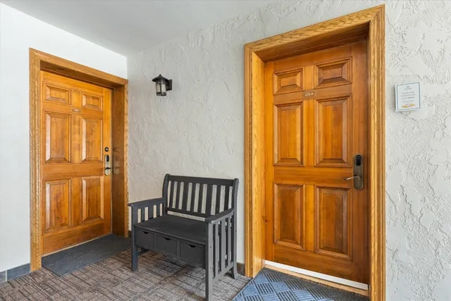 an entryway view with a wooden door