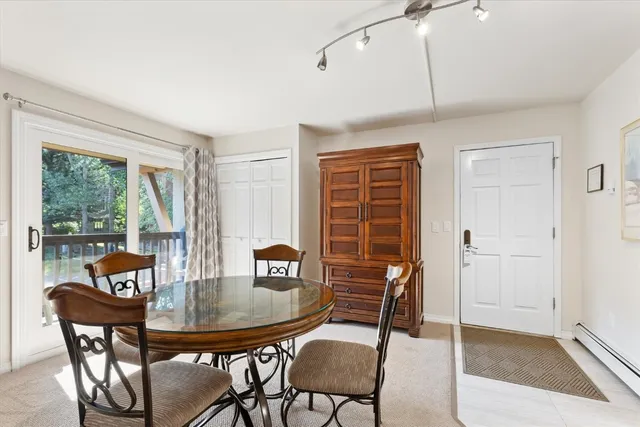a dining room with furniture and window