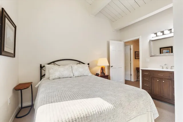 a bedroom with a bed and a dresser