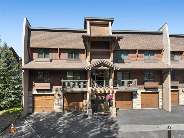 a swimming pool with outdoor seating and yard