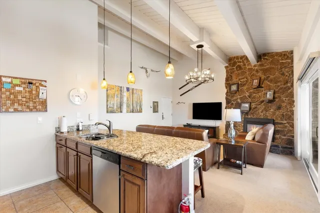 a kitchen with a stove and a table