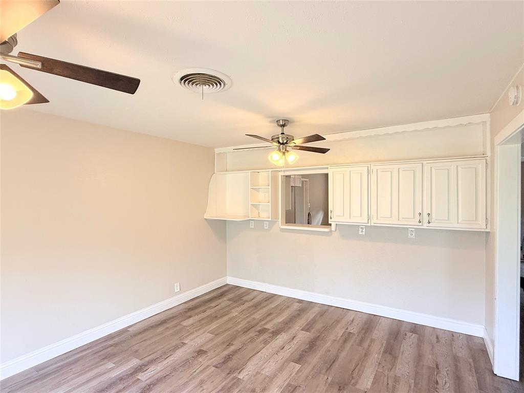 4075 Old Bonham Road Paris, TX 75460 - Photo 11 of 20 wooden floor in an empty room with a window