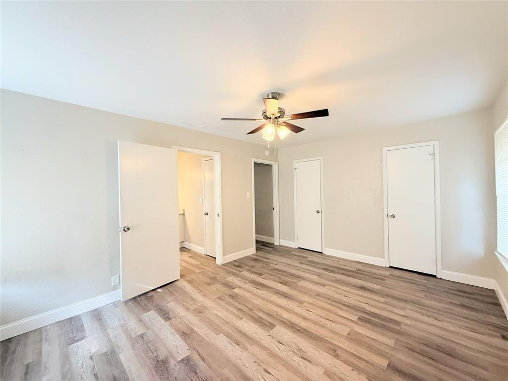 4075 Old Bonham Road Paris, TX 75460 - Photo 12 of 20 a view of an empty room with wooden floor