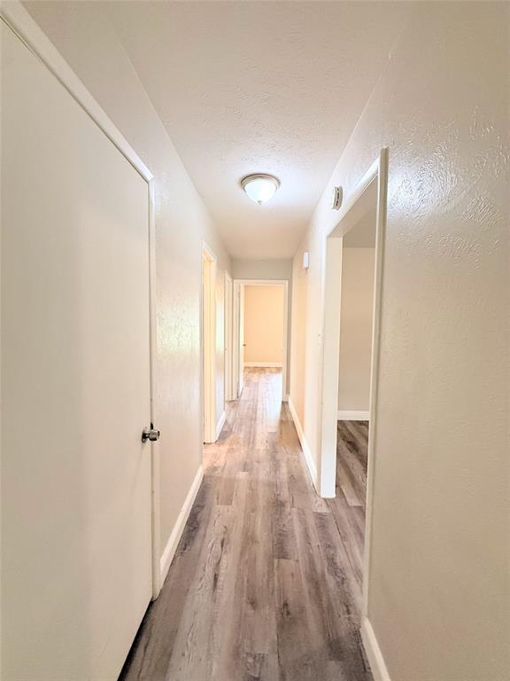 4075 Old Bonham Road Paris, TX 75460 - Photo 16 of 20 a view of hallway with wooden floor