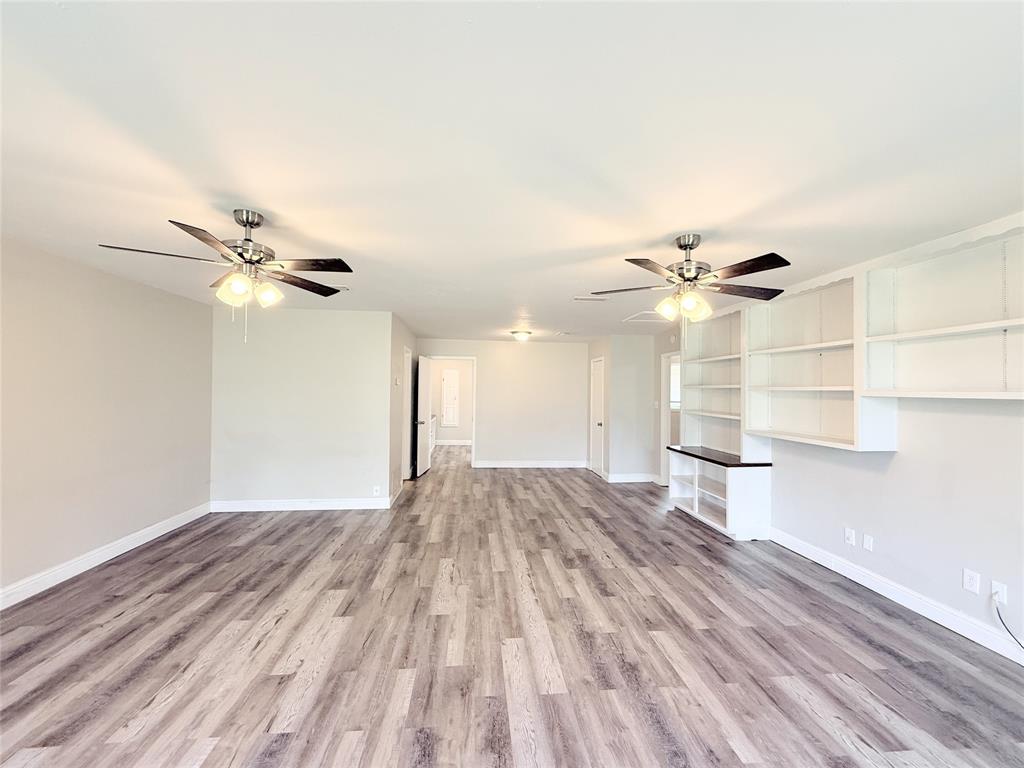 4075 Old Bonham Road Paris, TX 75460 - Photo 5 of 20 a view of empty room with wooden floor and fan