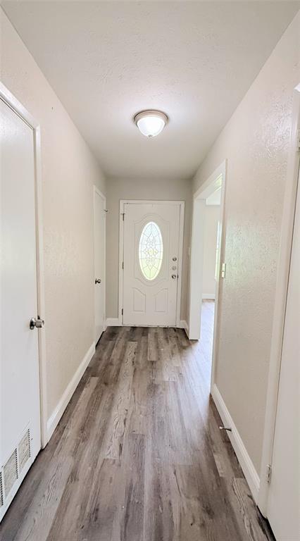 4075 Old Bonham Road Paris, TX 75460 - Photo 10 of 20 a view of a room with wooden floor
