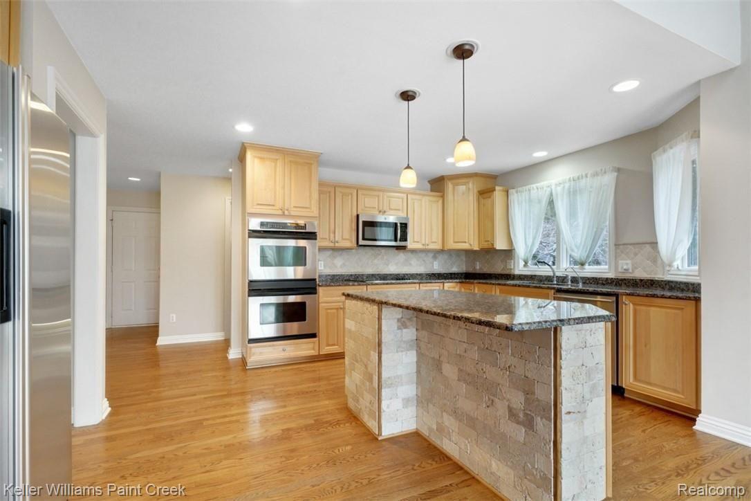 1400 Army Road Leonard, MI 48367 - Photo 21 of 56 Have your morning coffee at the large Kitchen island.