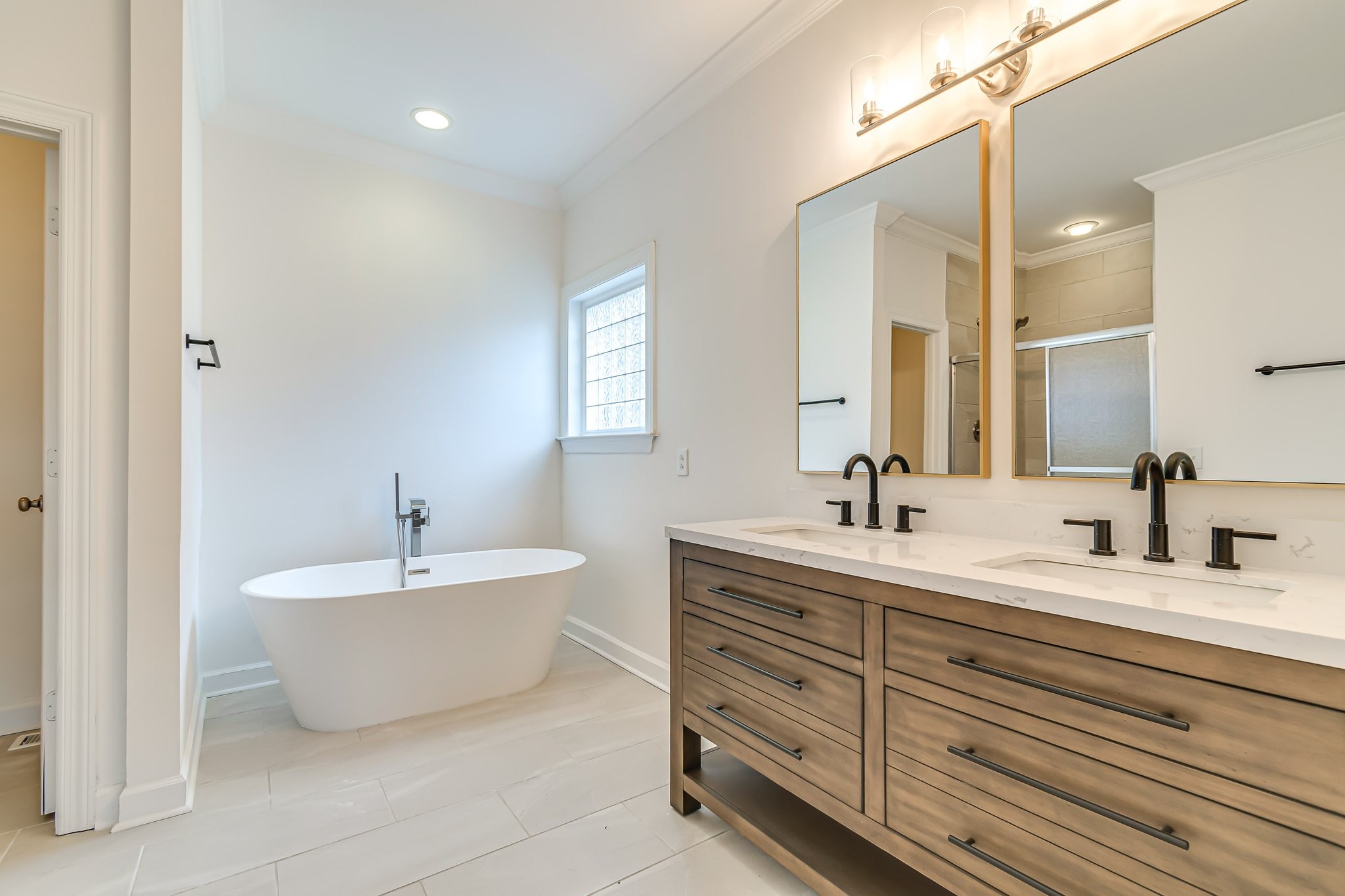 5126 Reagan Drive Murfreesboro, TN 37129 - Photo 11 of 20 a spacious bathroom with a double vanity sink mirror and bathtub