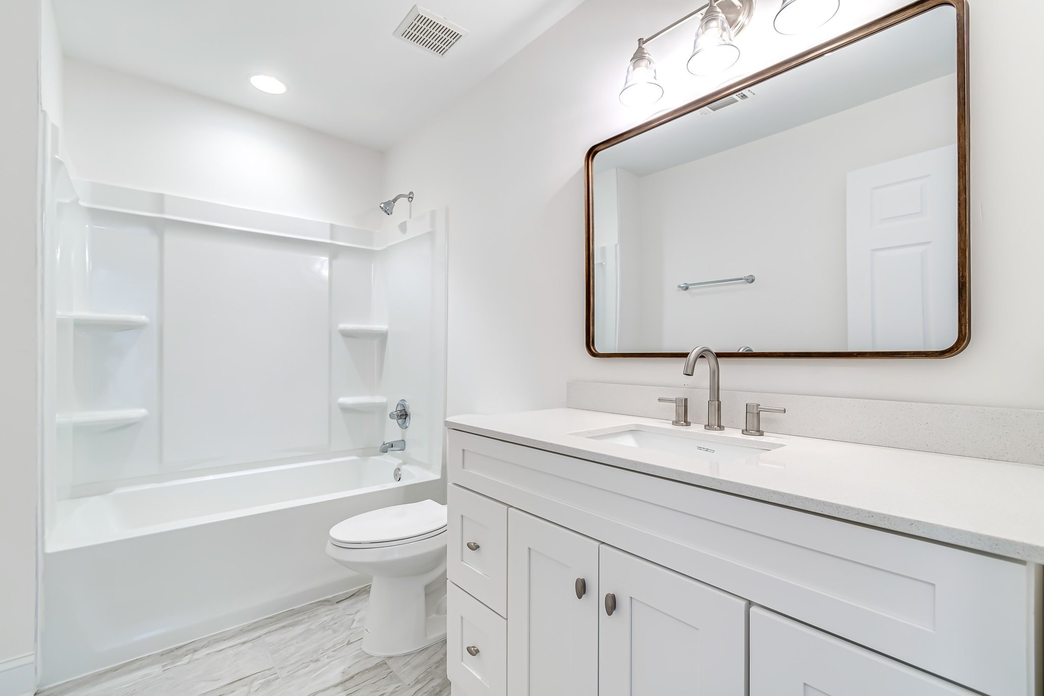 5126 Reagan Drive Murfreesboro, TN 37129 - Photo 15 of 20 a bathroom with a toilet a sink a bathtub and a mirror