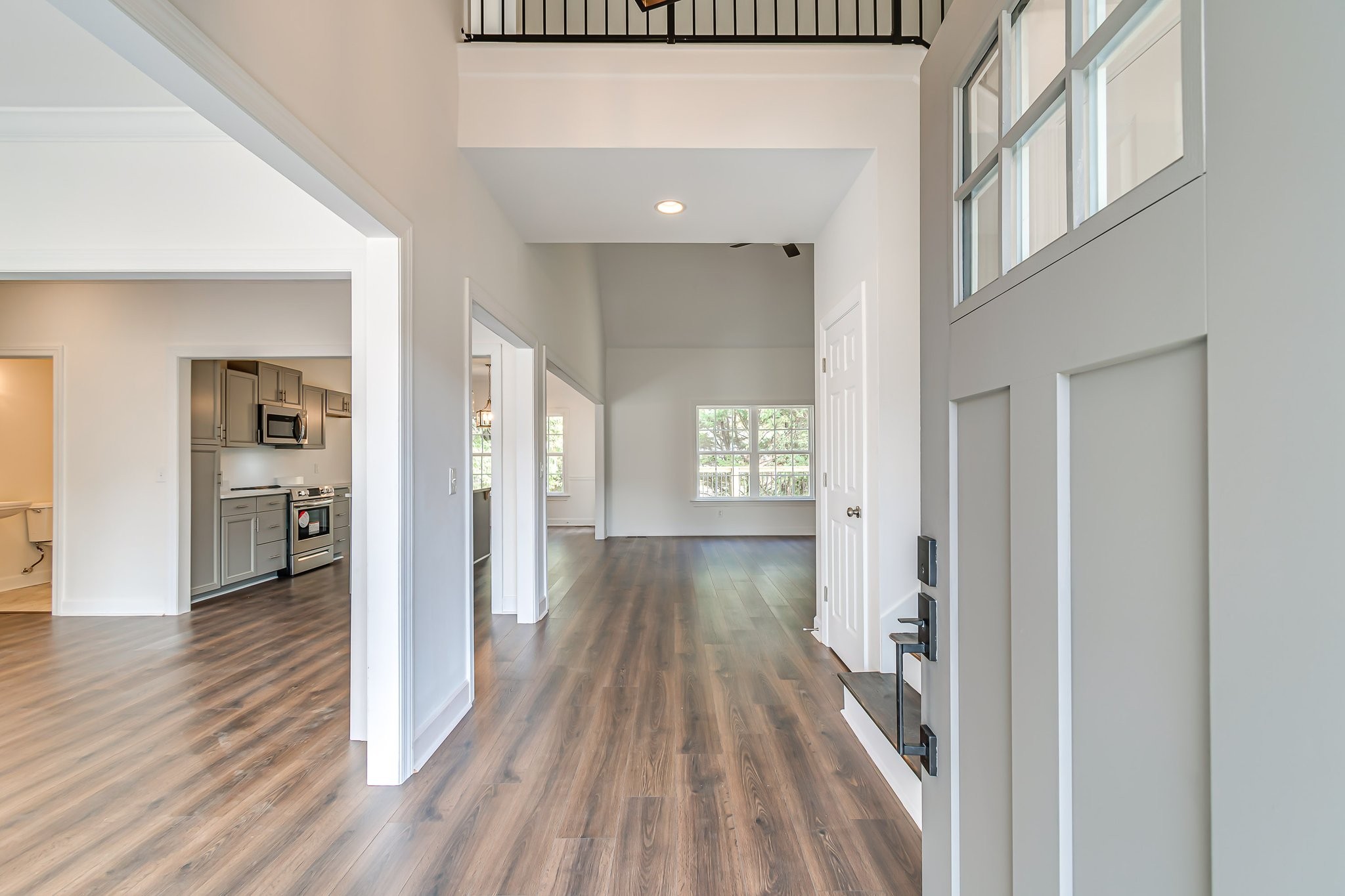 5126 Reagan Drive Murfreesboro, TN 37129 - Photo 2 of 20 a view of a hallway with wooden floor and a living room