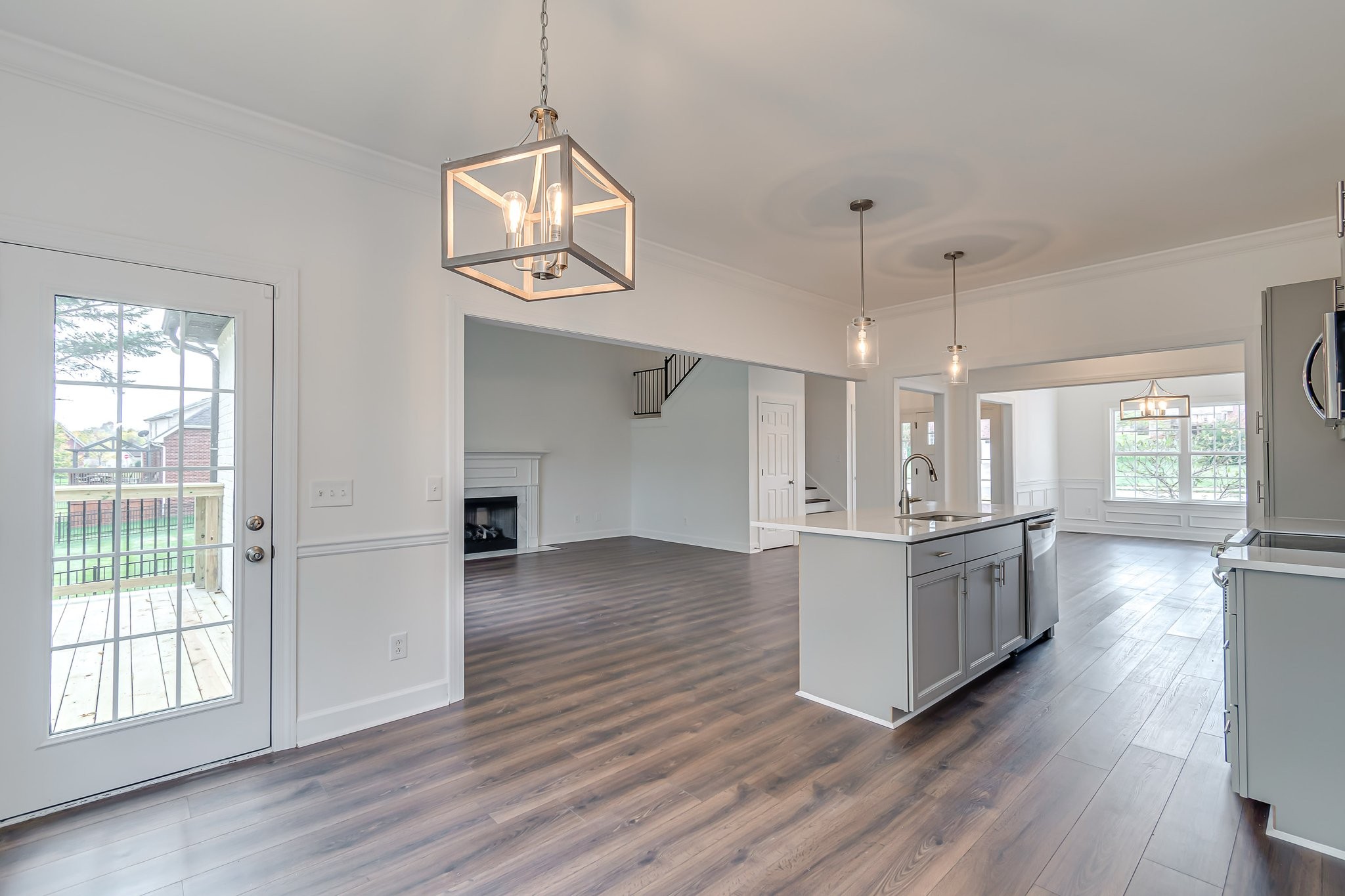 5126 Reagan Drive Murfreesboro, TN 37129 - Photo 7 of 20 a kitchen with stainless steel appliances granite countertop a stove and wooden floors