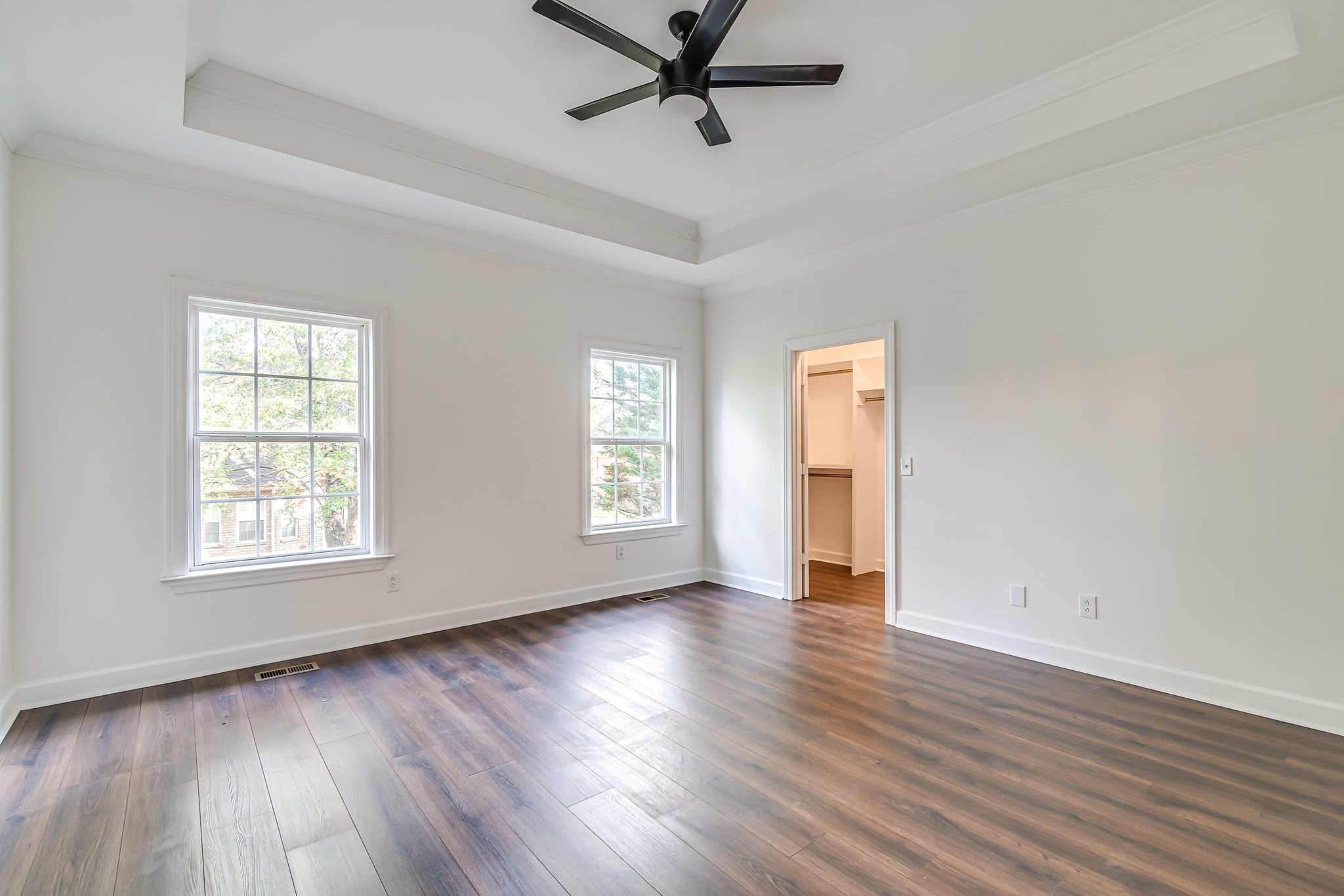 5126 Reagan Drive Murfreesboro, TN 37129 - Photo 9 of 20 an empty room with wooden floor and windows