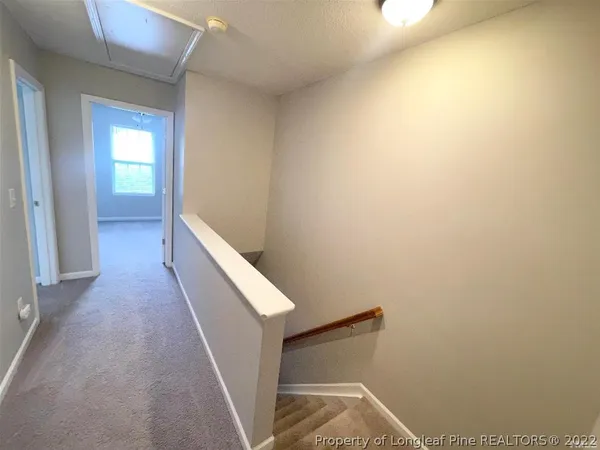 a view of hallway with stairs