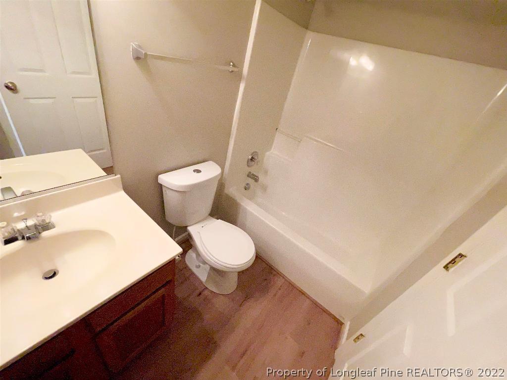 13 Edgebrook Circle Durham, NC 27703 - Photo 17 of 20 a white toilet sitting next to a bathroom sink