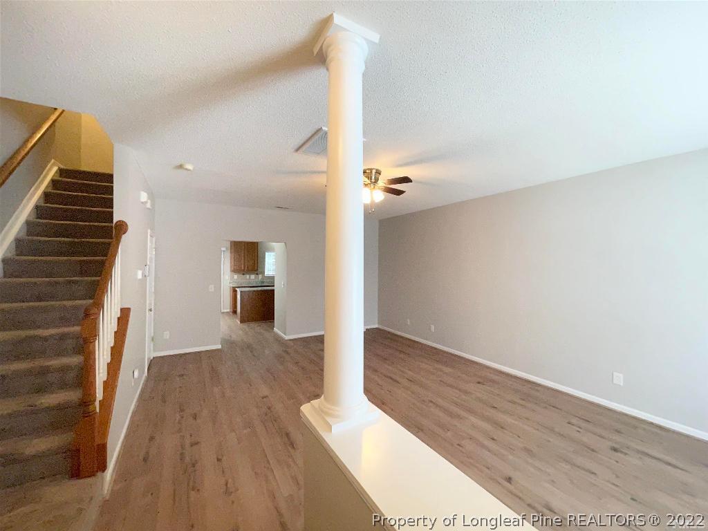 13 Edgebrook Circle Durham, NC 27703 - Photo 10 of 20 a view of a hallway with wooden floor and staircase