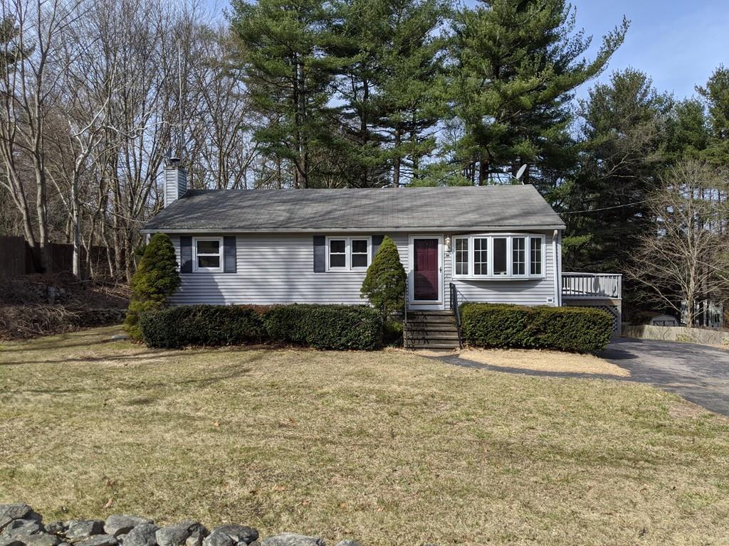 453 Cooper Road Northbridge, MA 01534 - Photo 1 of 25 a front view of a house with a yard covered in snow