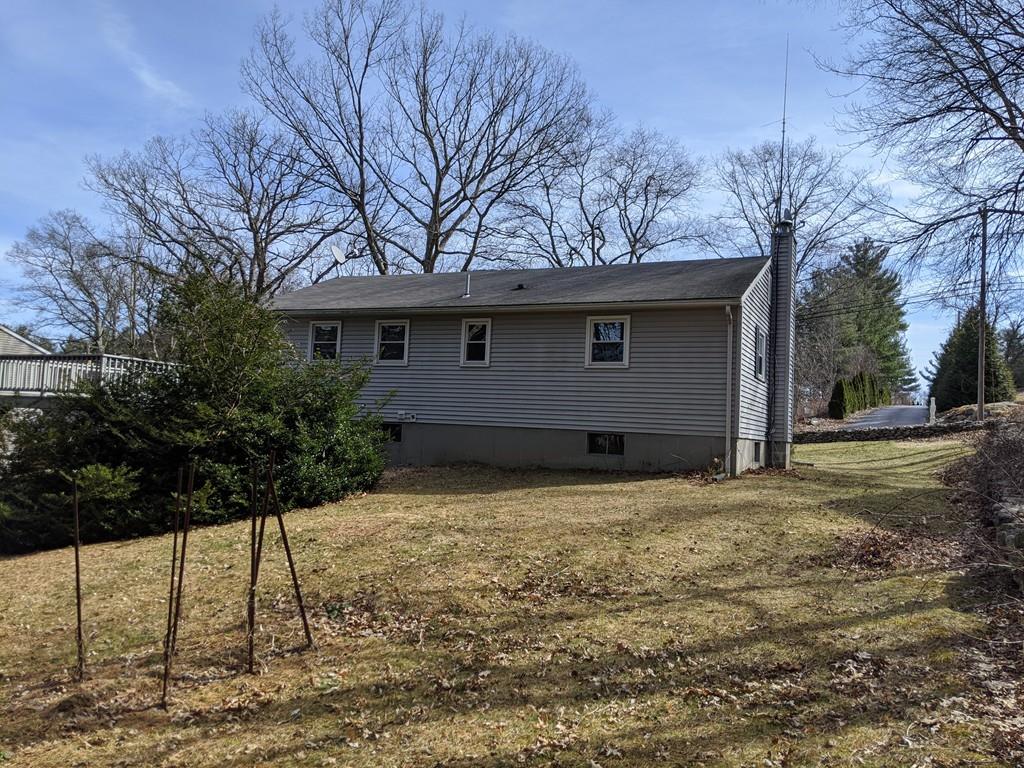 453 Cooper Road Northbridge, MA 01534 - Photo 4 of 25 a house with trees in front of it