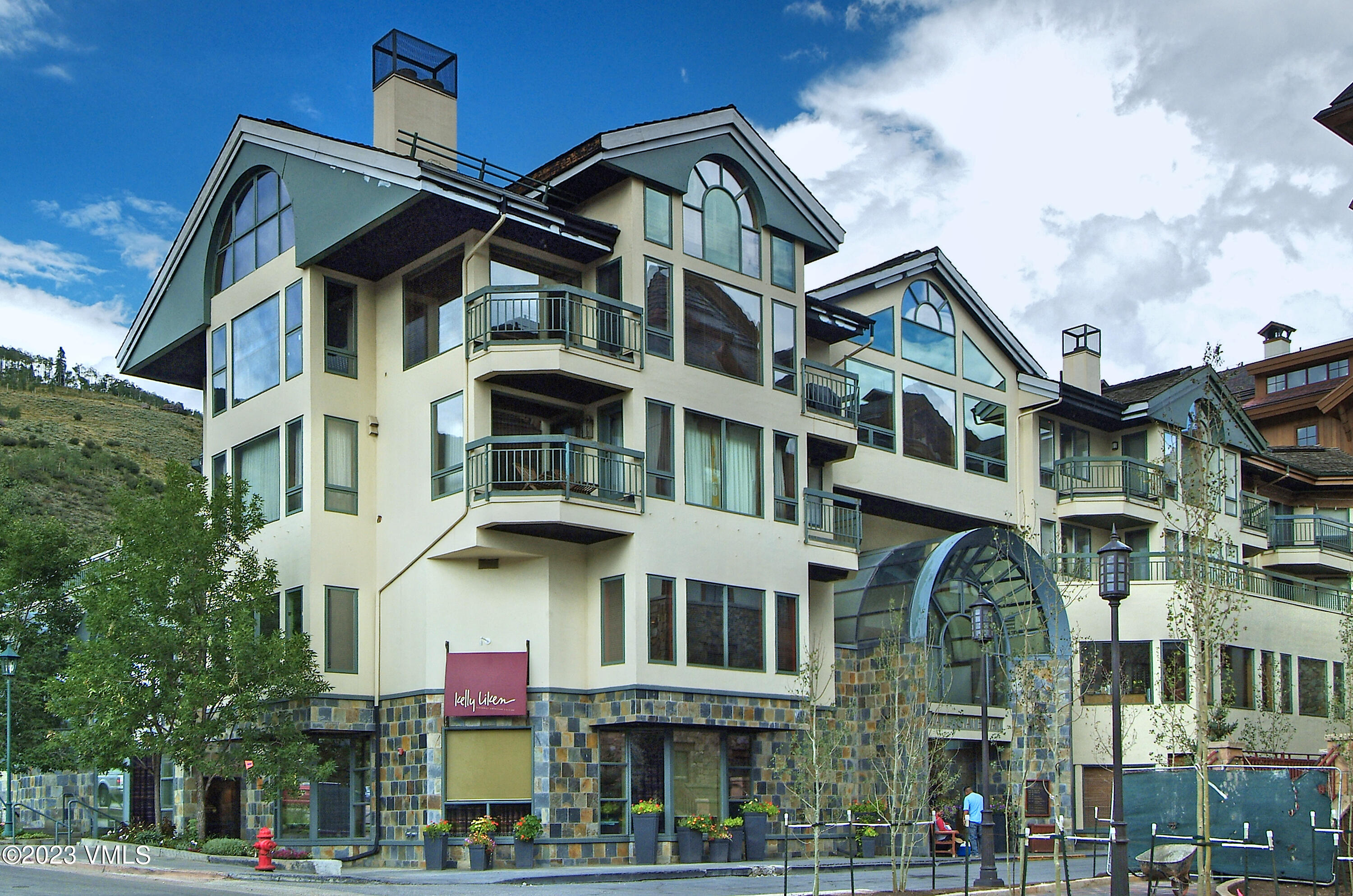 12 Vail Road, Unit P13 Vail, CO 81657 - Photo 3 of 3 a front view of a residential apartment building with a yard