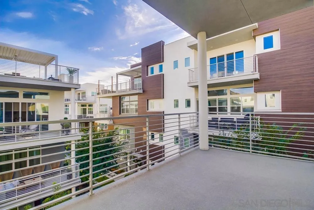2035 Bravo Loop, Unit 6 Chula Vista, CA 91915 - Photo 17 of 39 a view of a brick house with many windows