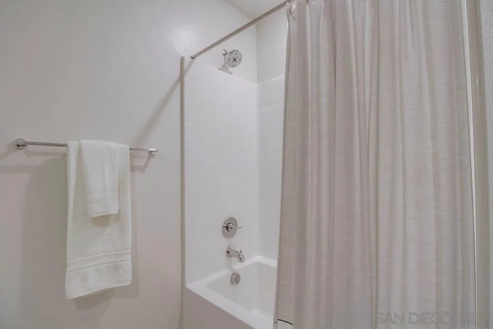 2035 Bravo Loop, Unit 6 Chula Vista, CA 91915 - Photo 25 of 39 a bathroom with a shower and a tub