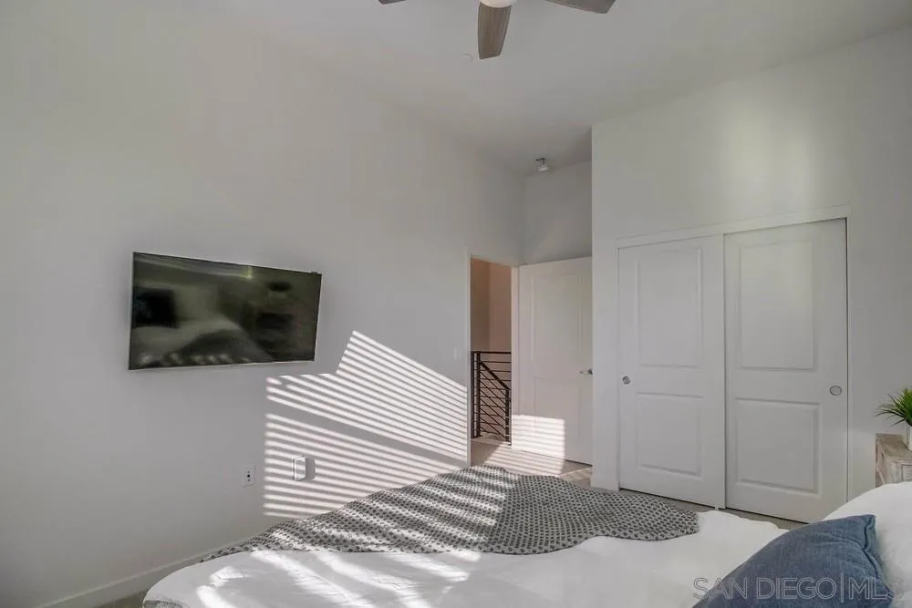 2035 Bravo Loop, Unit 6 Chula Vista, CA 91915 - Photo 28 of 39 a bedroom with a bed and a television