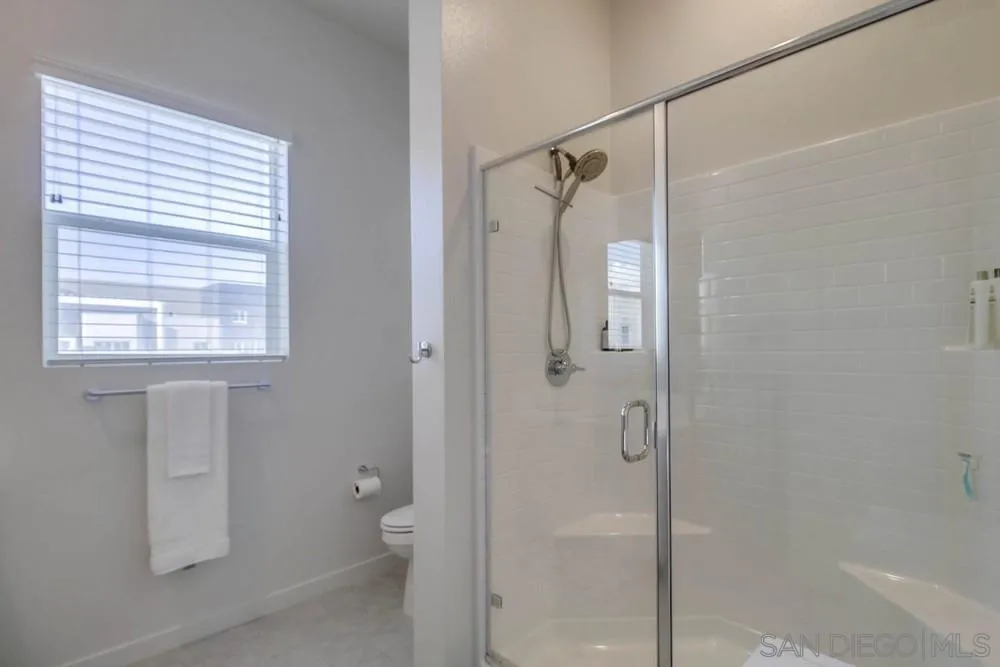 2035 Bravo Loop, Unit 6 Chula Vista, CA 91915 - Photo 30 of 39 a bathroom with a shower and a window