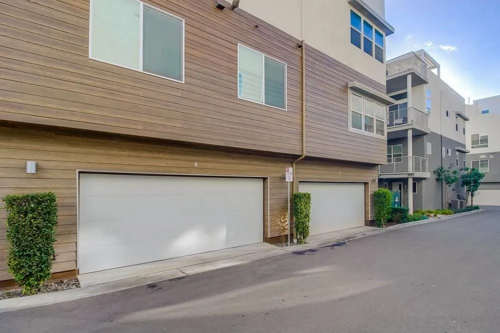 2035 Bravo Loop, Unit 6 Chula Vista, CA 91915 - Photo 38 of 39 a front view of a house with a garage