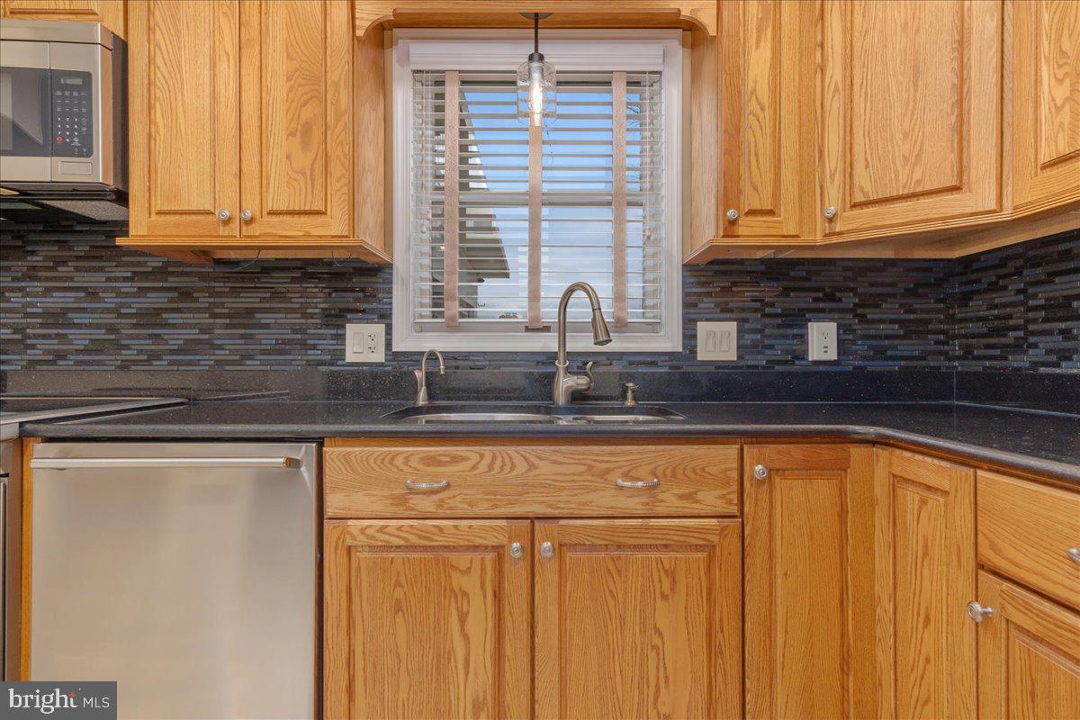 11 Funkstown Road Hagerstown, MD 21740 - Photo 13 of 39 a kitchen with granite countertop white cabinets and a window