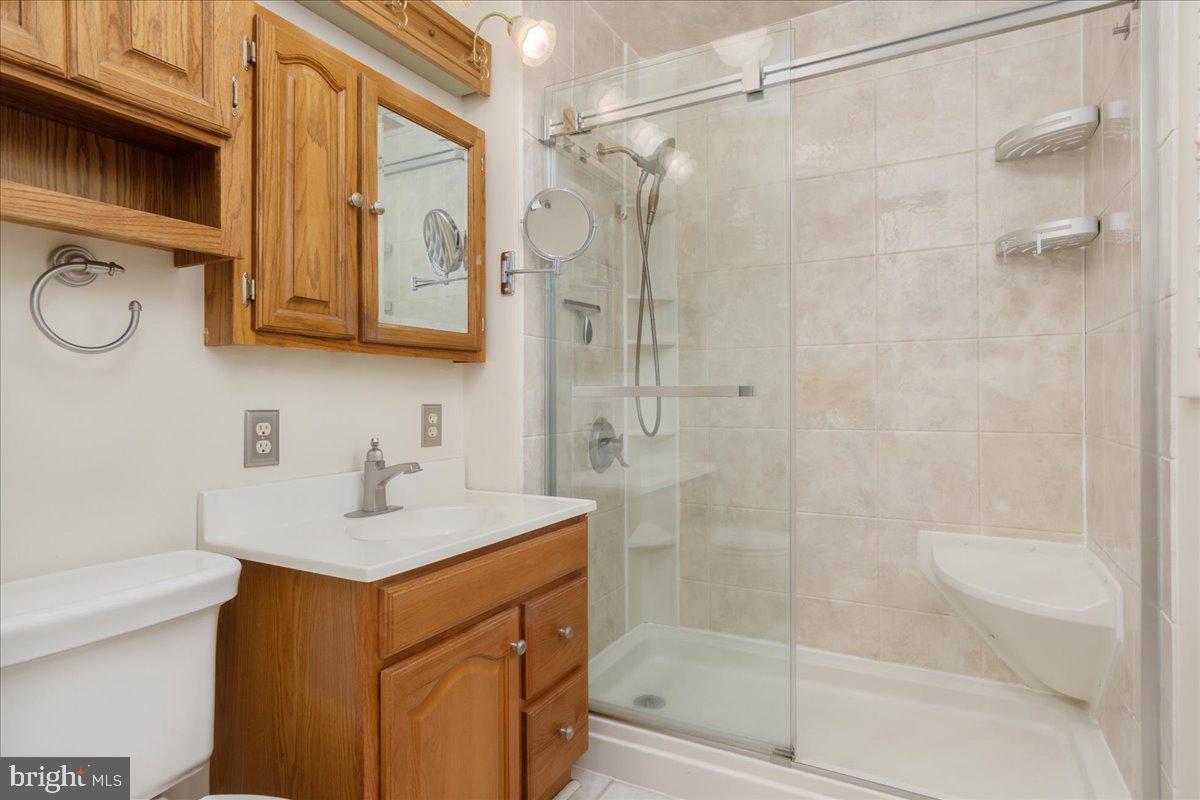 11 Funkstown Road Hagerstown, MD 21740 - Photo 17 of 39 a bathroom with a sink a toilet and shower