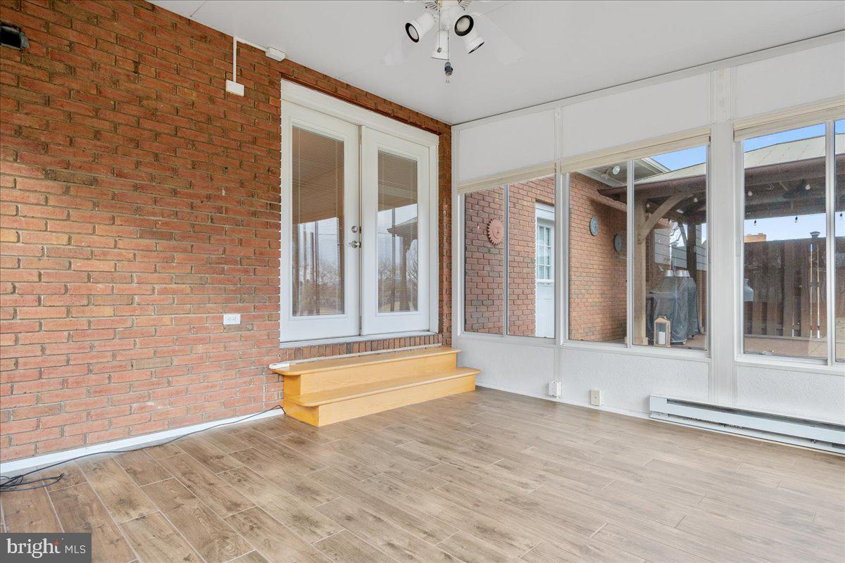 11 Funkstown Road Hagerstown, MD 21740 - Photo 31 of 39 a view of backyard with brick wall and floor to ceiling window