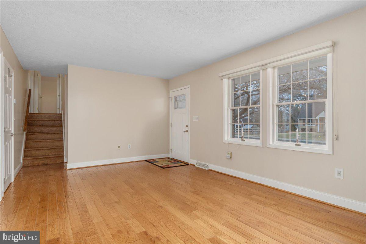 11 Funkstown Road Hagerstown, MD 21740 - Photo 7 of 39 a view of an empty room with wooden floor and a window