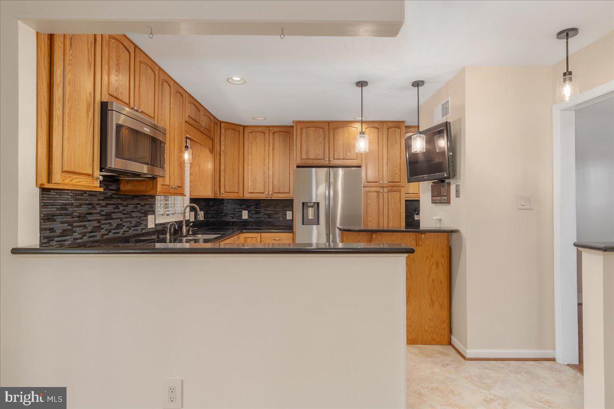 11 Funkstown Road Hagerstown, MD 21740 - Photo 10 of 39 a kitchen with stainless steel appliances granite countertop a refrigerator a stove and a sink