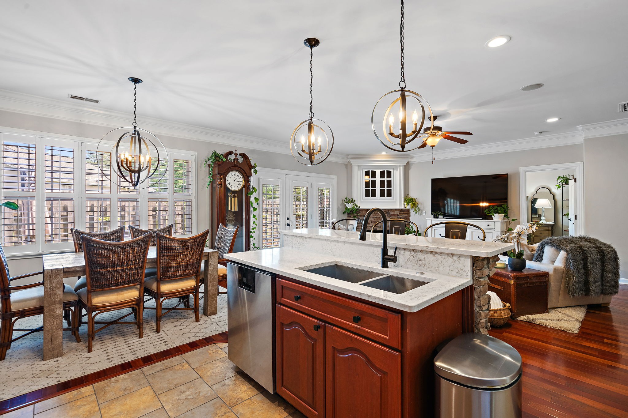 2521 Pennington Bend Road, Unit 214 Nashville, TN 37214 - Photo 11 of 25 a view of dining room and kitchen countertops with furniture wooden floor clock and a chandelier