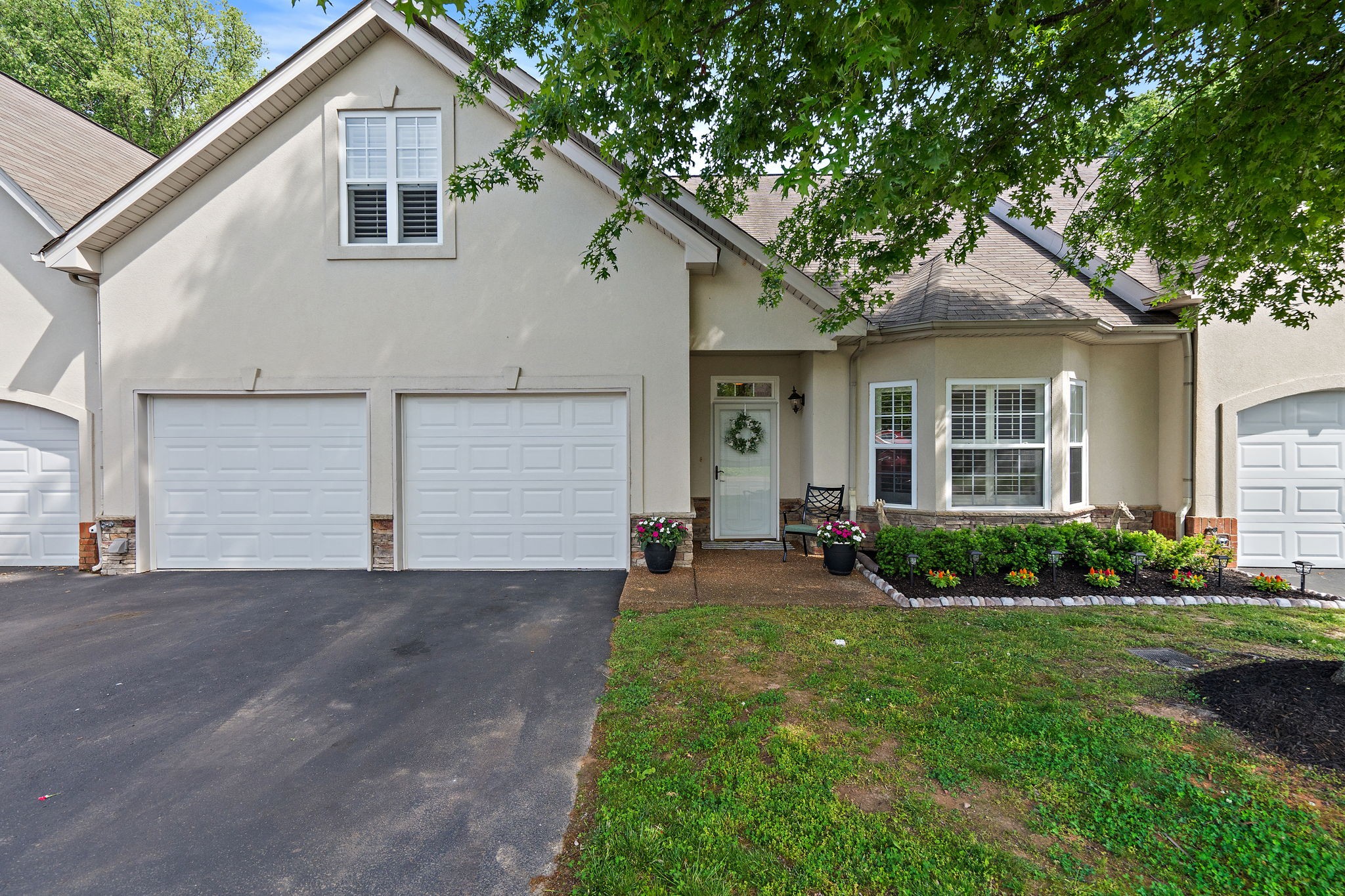 2521 Pennington Bend Road, Unit 214 Nashville, TN 37214 - Photo 2 of 25 a front view of a house with a yard and garage