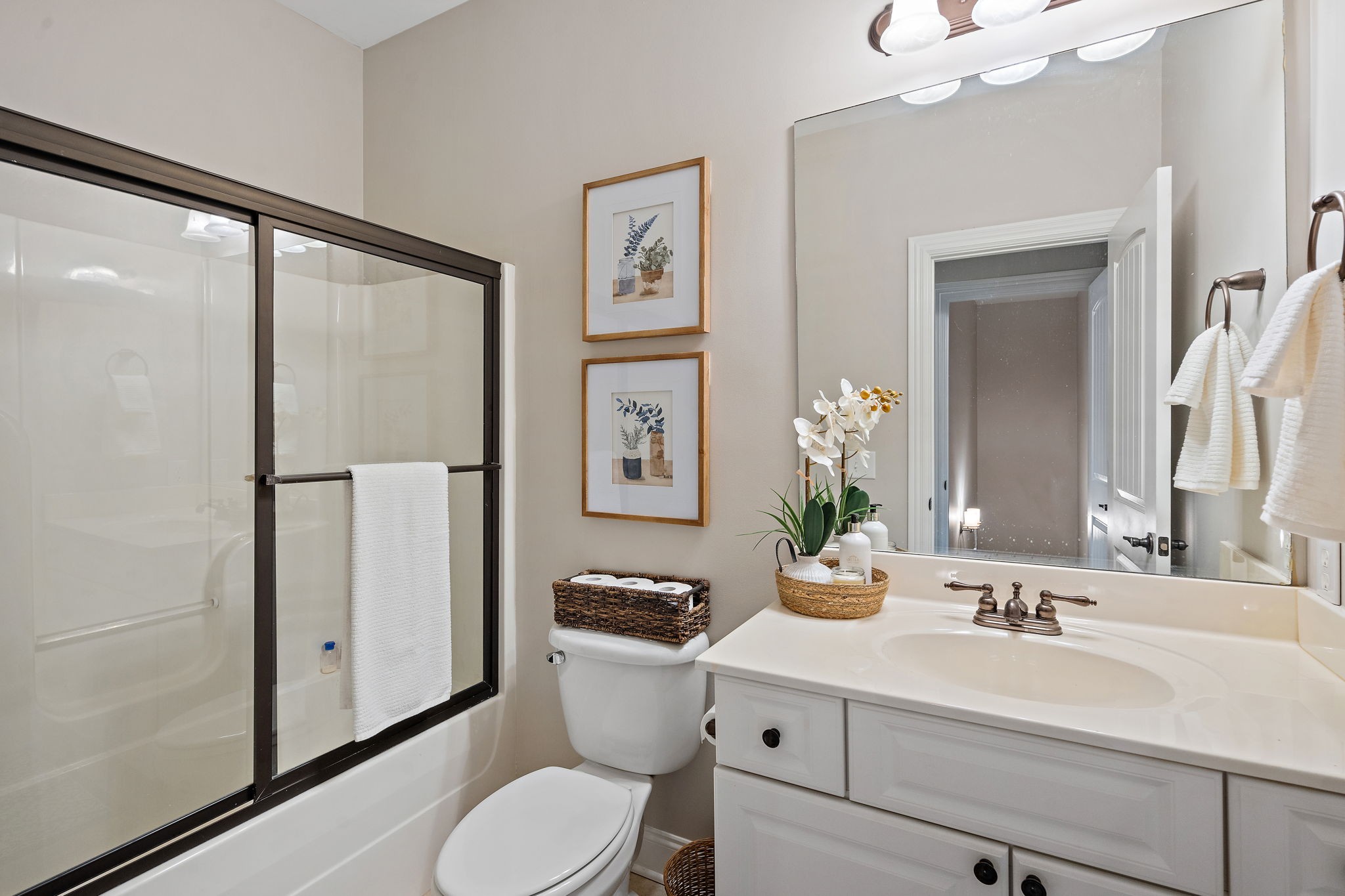 2521 Pennington Bend Road, Unit 214 Nashville, TN 37214 - Photo 21 of 25 a bathroom with a toilet a sink and a mirror