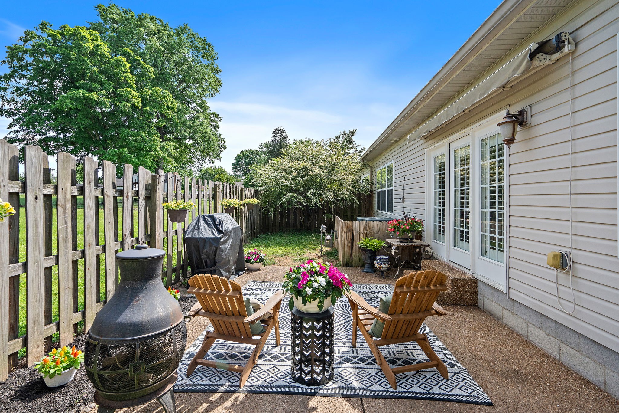 2521 Pennington Bend Road, Unit 214 Nashville, TN 37214 - Photo 23 of 25 a view of a patio with chairs and a potted plant