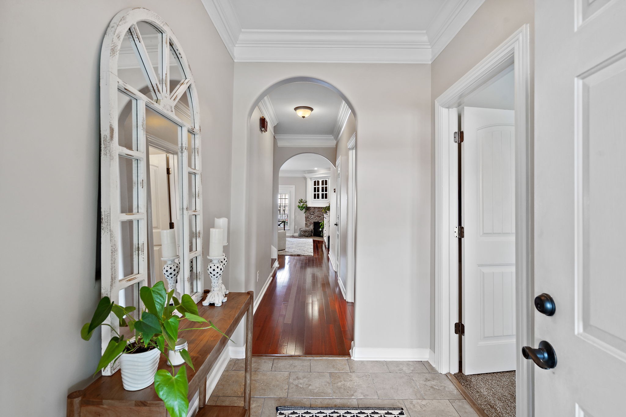 2521 Pennington Bend Road, Unit 214 Nashville, TN 37214 - Photo 3 of 25 a view of a hallway with wooden floor and a chandelier